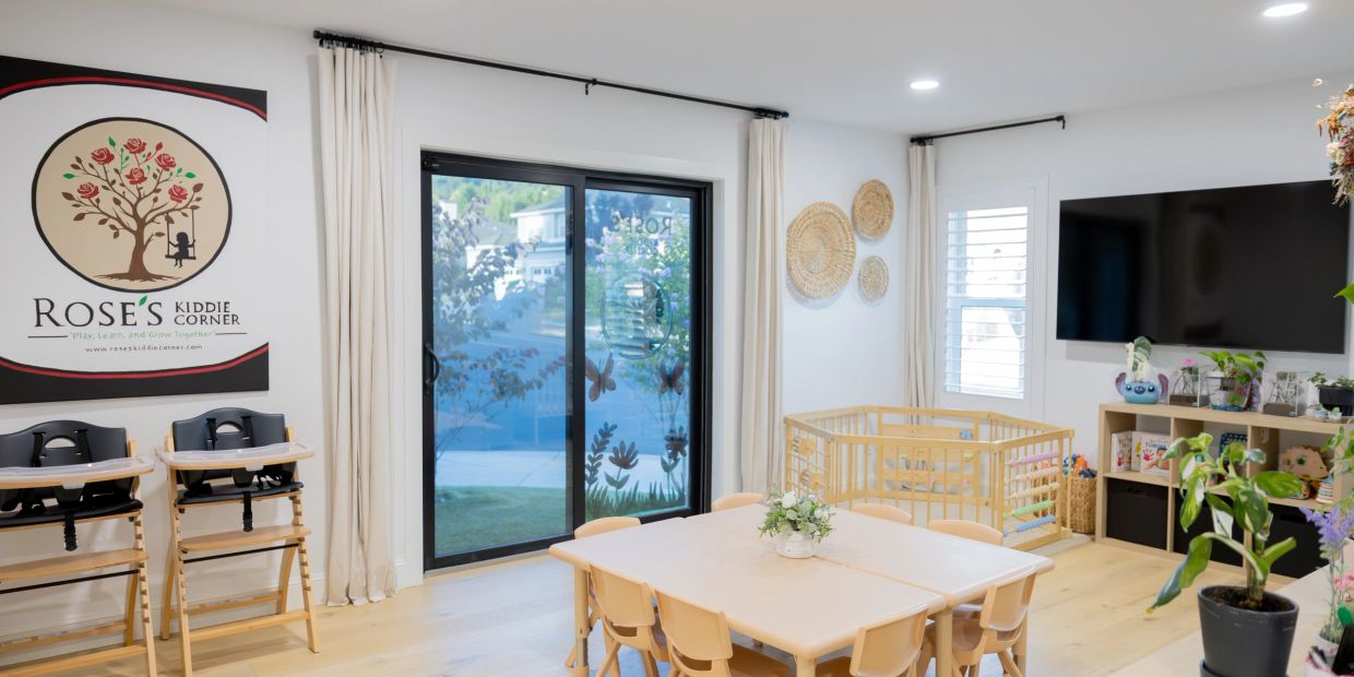 Bright and cozy children's playroom with table and TV.