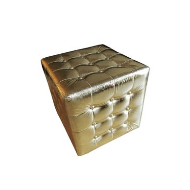 Gold tufted leather ottoman cube.