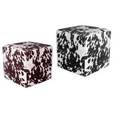 Two cube-shaped ottomans with black and white spotted patterns.