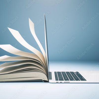 A book blending into a laptop keyboard.