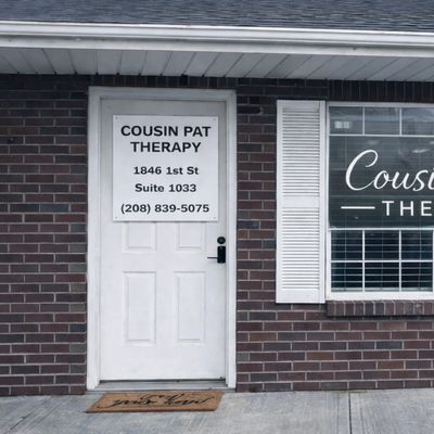  "Cousin Pat Therapy Idaho Falls office entrance 1846 1st St Suite 1033." 