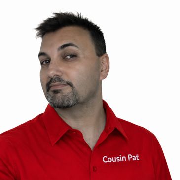 Man in red shirt with "Cousin Pat" embroidered on it.