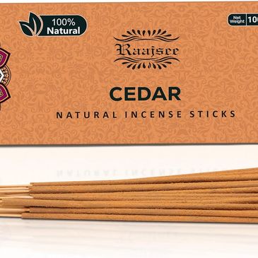 Incense sticks with holder on table, used for cleansing, calm, meditation and spiritual reflection.