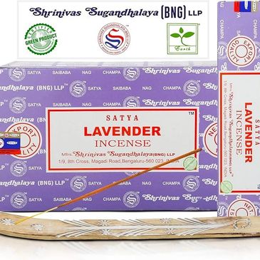 Incense sticks with holder on table, used for cleansing, calm, meditation and spiritual reflection.