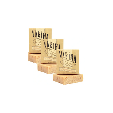 Organic lavender oatmeal bar soap in a natural spa setting with soft lighting and herbal textures.