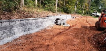 Stone work, creating a stone retaining wall