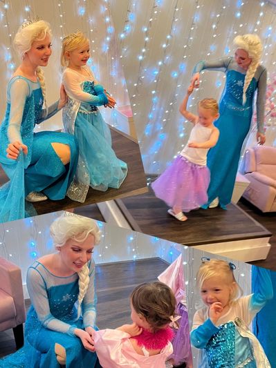Two women dressed as Elsa from Frozen entertaining young girls in princess dresses.