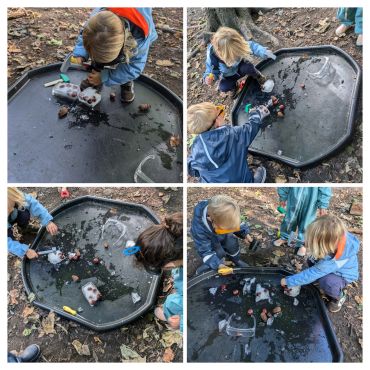Children playing with frozen ice and toys outside.