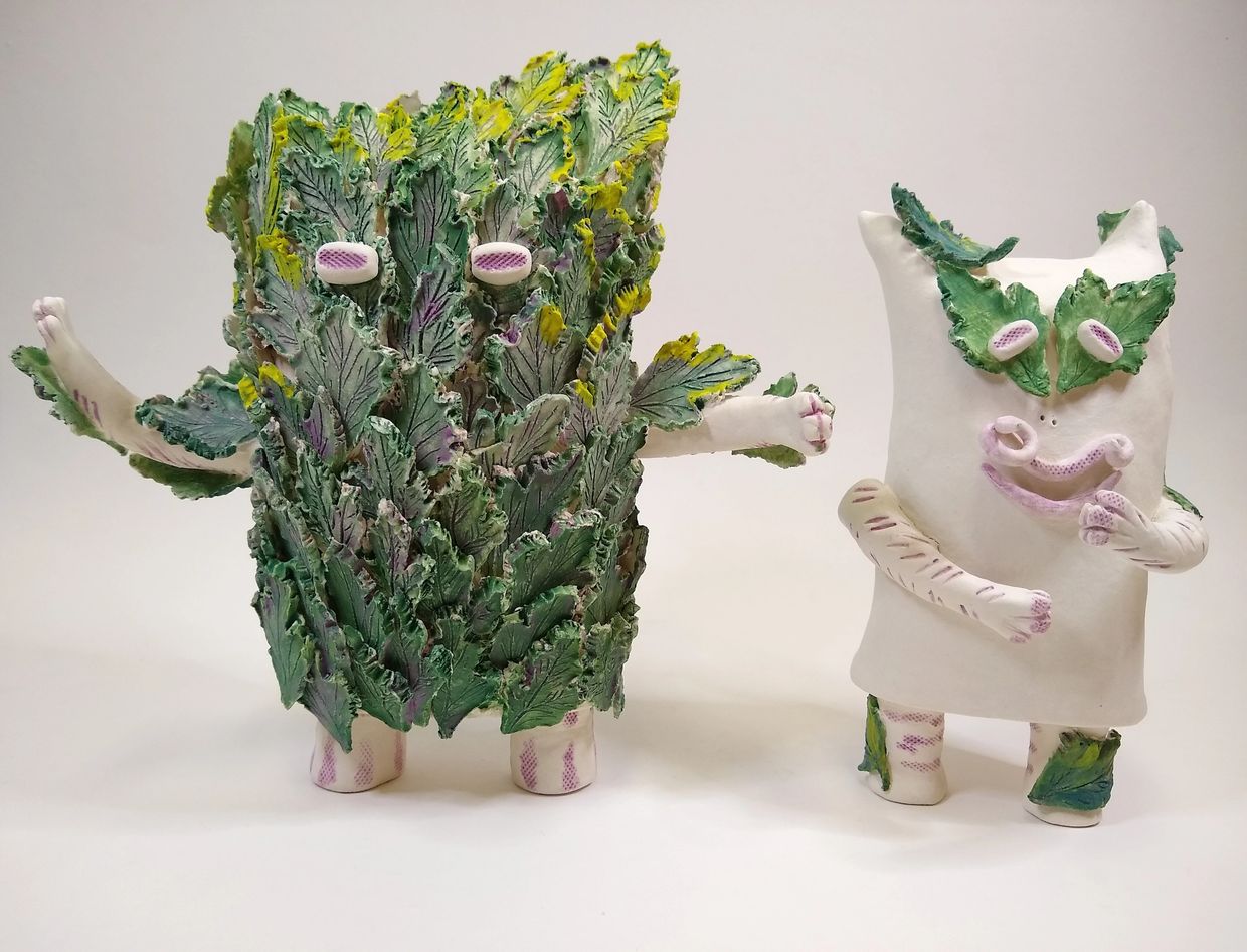 set of 2 standing leafy handmade ceramic monsters