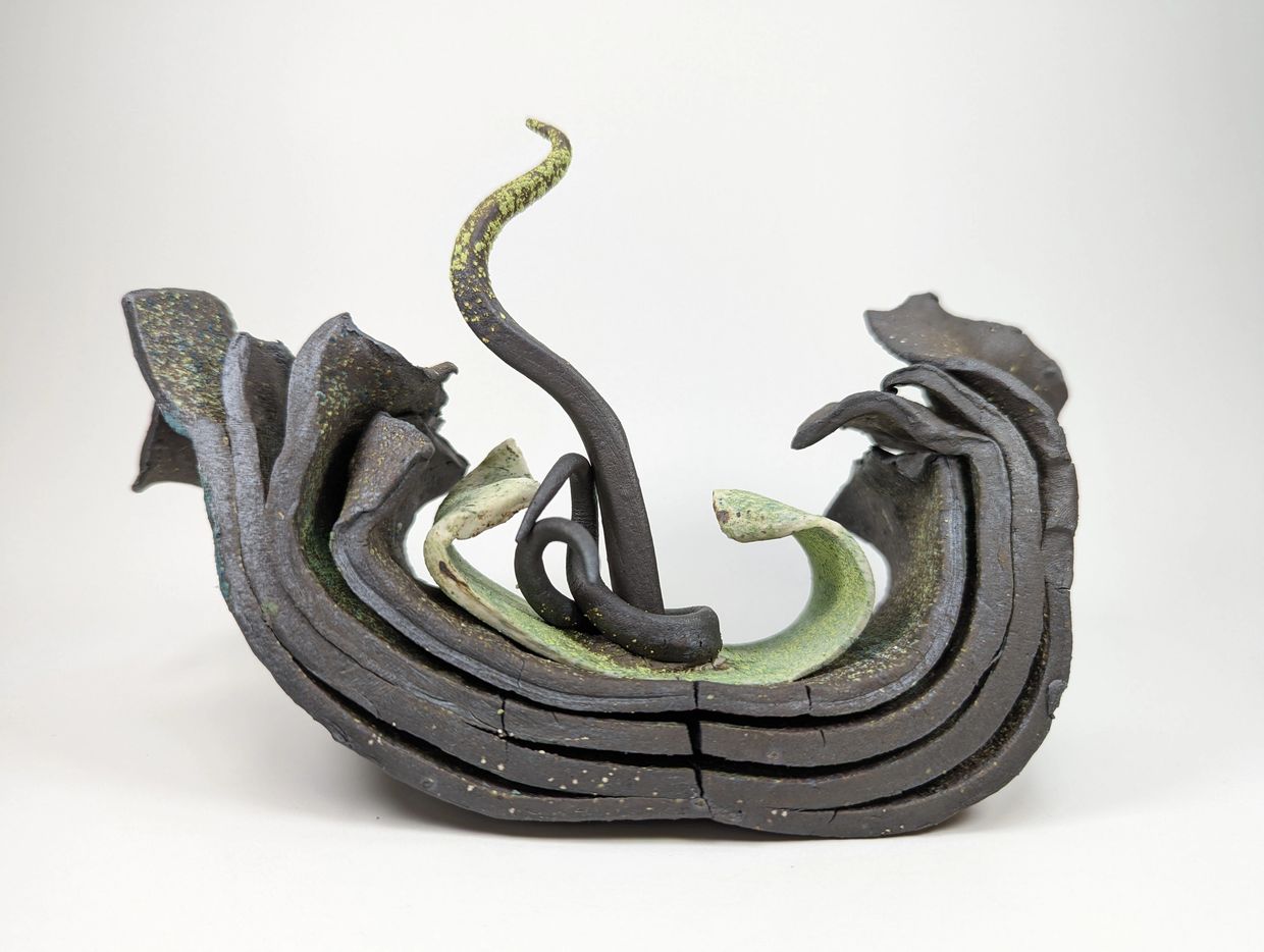 abstract ceramic table decor sculpture, inspired by plant steams out of layers of cracked earth dirt