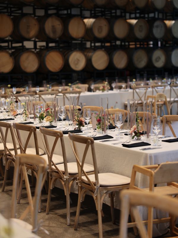 Seattle corporate event planner designed an elegant winery dinner setup with long banquet tables