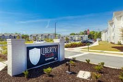 The Liberty Club apartment sign in front of the apartments.