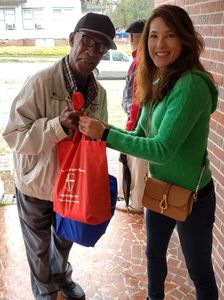 Giving bags of food to recipient