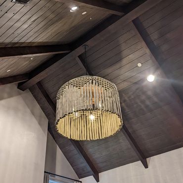 Boheimian chandelier installation in living room