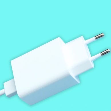 White European plug charger on a blue background.