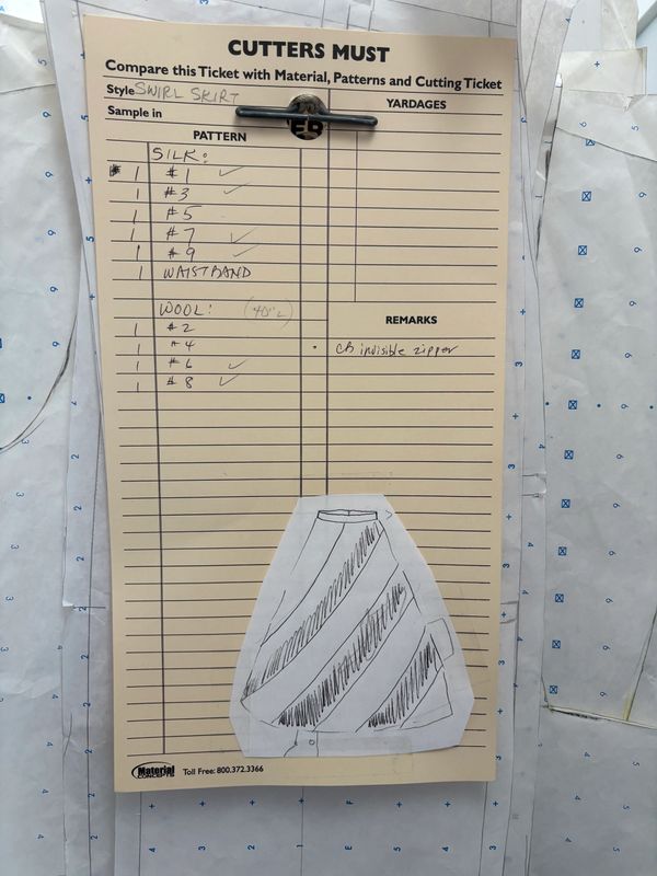 Cutting ticket for swirl skirt with silk and wool patterns, including a waistband and invisible zipper.