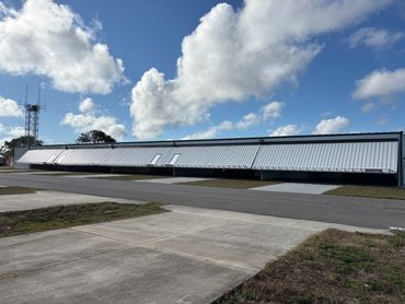 Nested T-Hangar System with Powerlift Hydraulic Doors utilizing ProAm DoorLink  