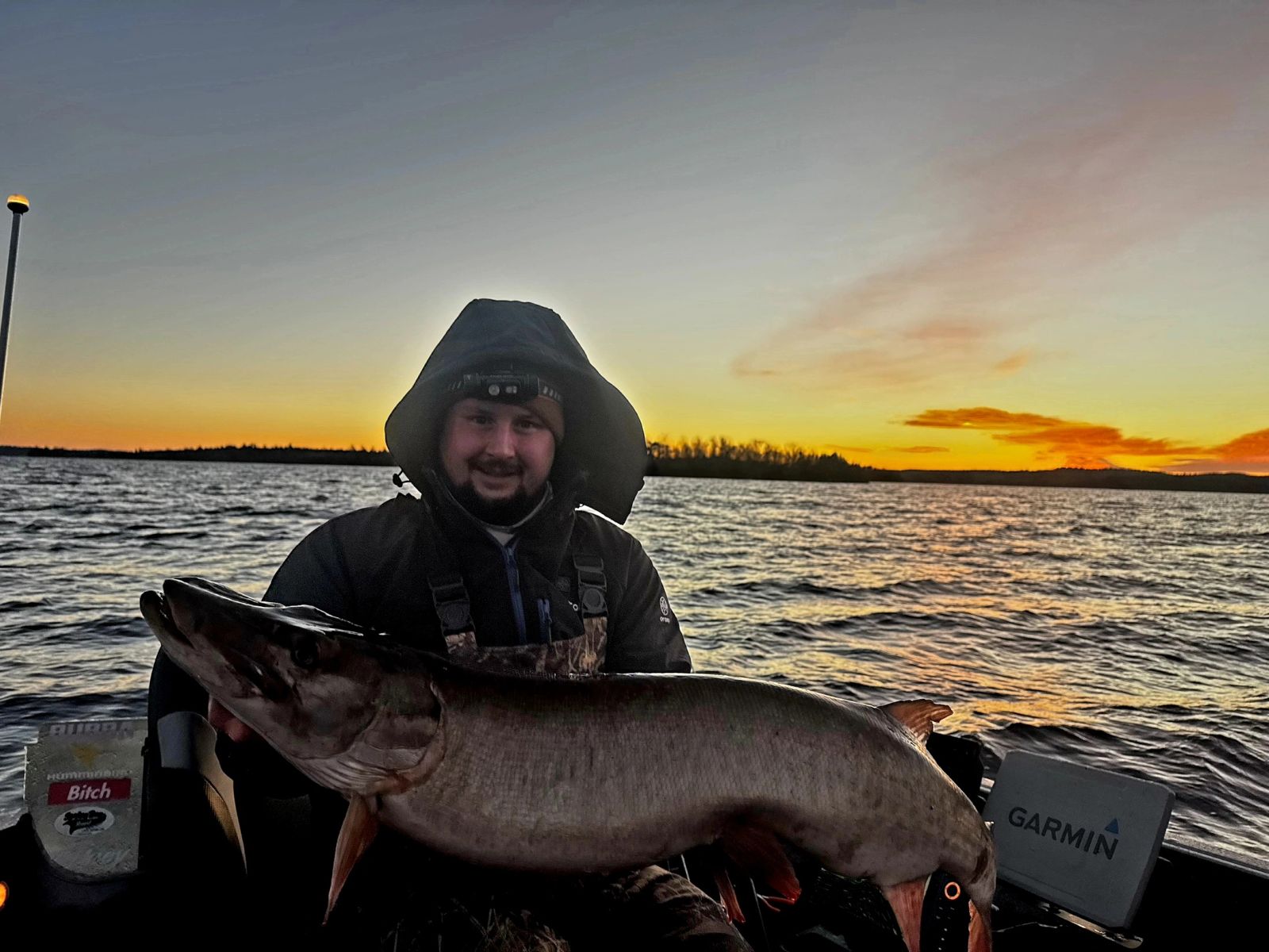 Angler with a trophy muskie at sunset on Lake Vermilion