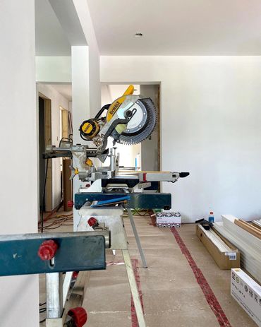 Miter saw set up for the millwork portion of a full home remodel in waterloo
