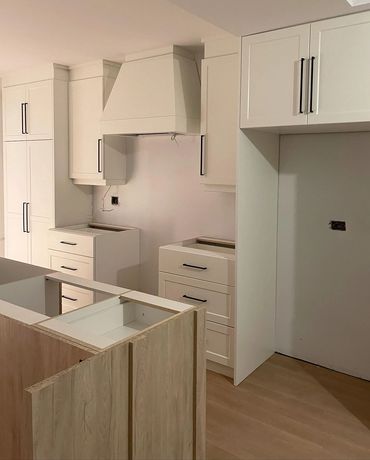 White oak island and off white cabinets ready for counters in the east ward, kitchener