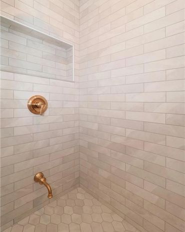 White slate tile, oversized custom shower niche, brushed gold shower valve, in down town Kitchener