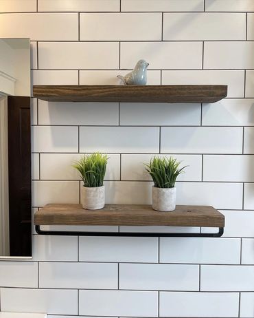 Large format subway tile, with floating shelves above the toilet. in a century home  in Kitchener 
