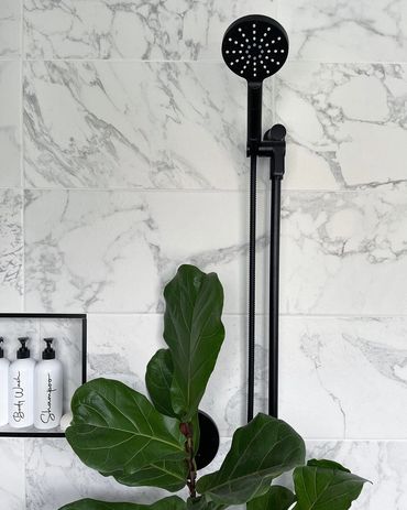 Riobel shower fixtures in a beautiful tiled shower 