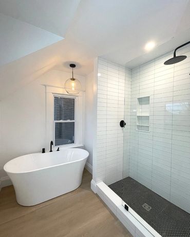 Beautiful 4 piece washroom with freestanding tub, and white oak vanity. Lighted led mirror