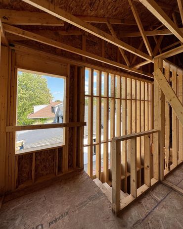 Custom home being framed in Preston, Ontario. Looking into the stairwell, with engineered tall wall