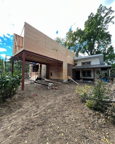 Second story addition being built on helical piers, with a covered patio under. In Midtown Kitchener