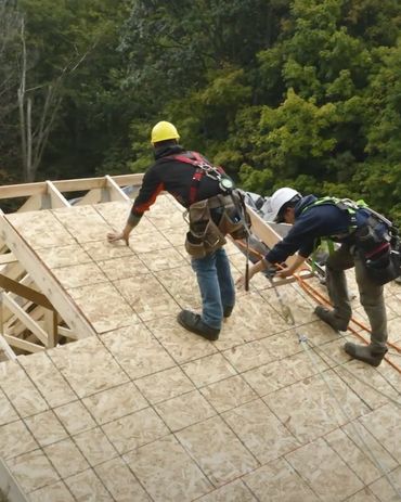 Large roof on a custom addition being covered with plywood, in Cambridge Ontario 
