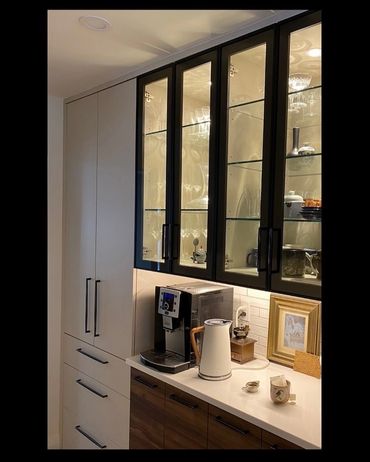 A coffee bar that was included in a kitchen renovation. Including glass door upper cabinets