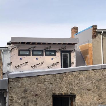 Second story addition over a century building in Hespler. Walk out to roof top patio