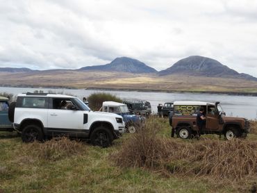 Land Rovers on Islay with the Paps of Jura across the sound on the Isle of Jura 