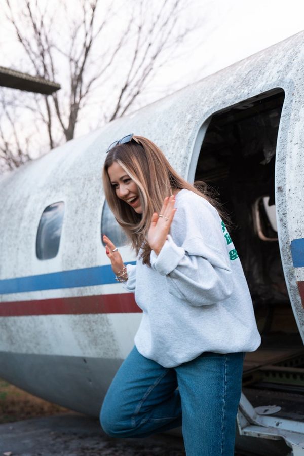girl exiting airplane