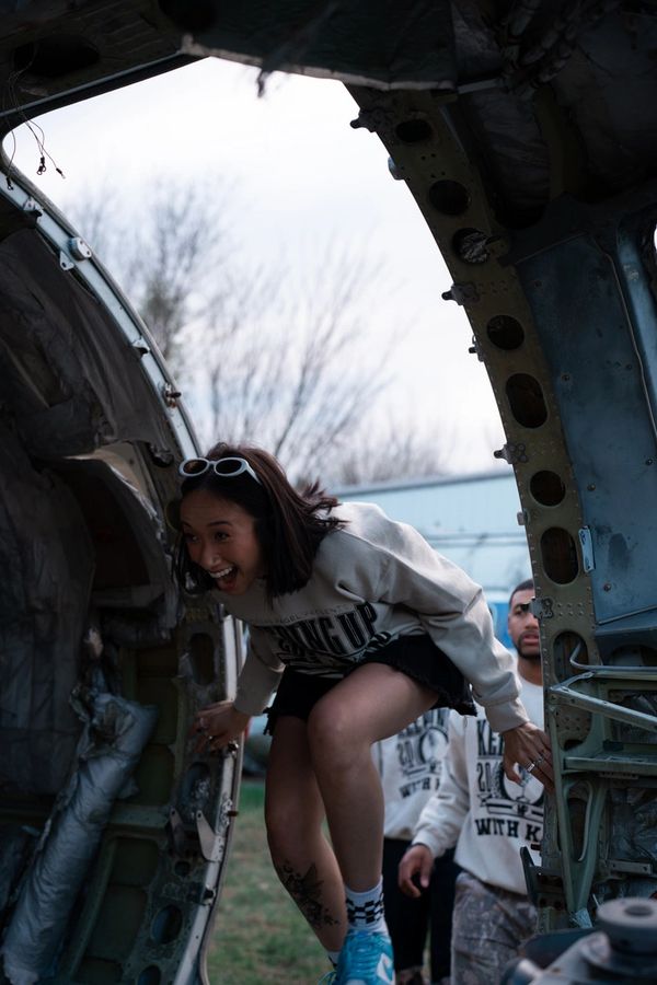 girl walking into airplane