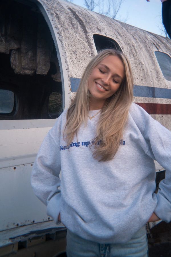 blonde girl in crewneck