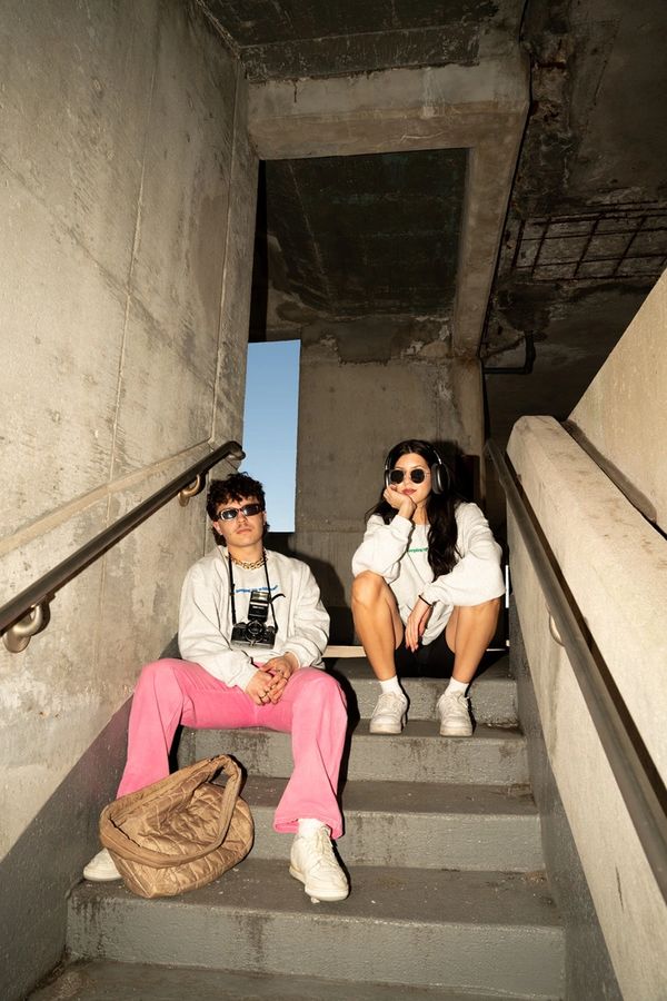 guy and girl sitting on stairs