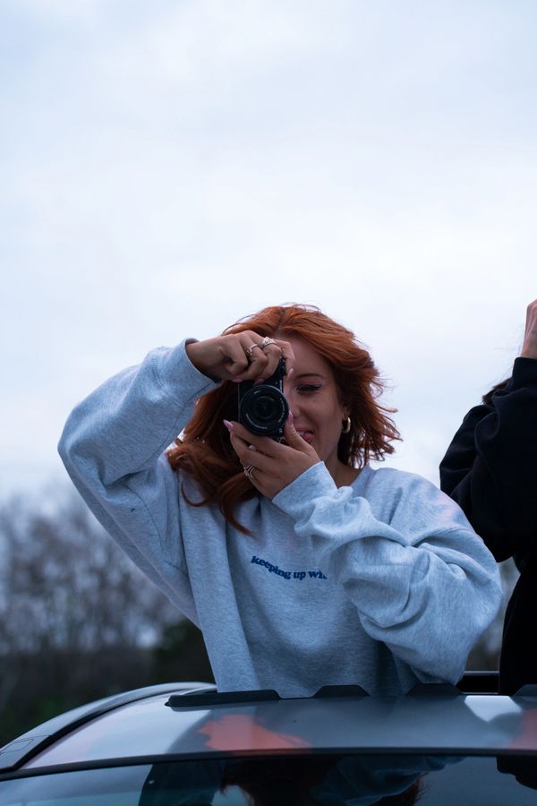 red head taking a picture