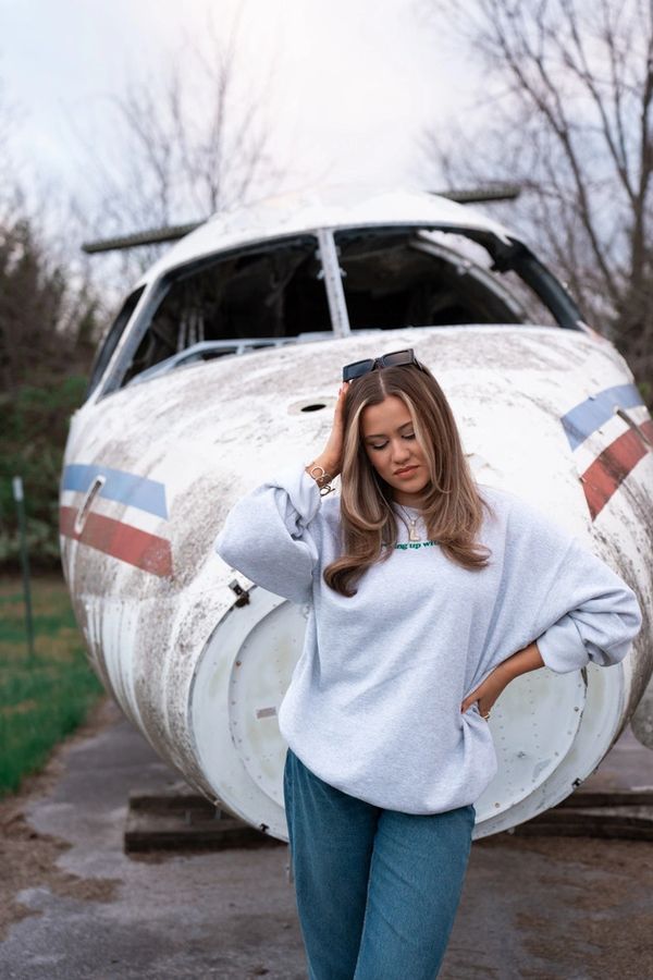 girl in front of airplane