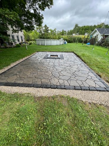Flagstone patio with central fire pit