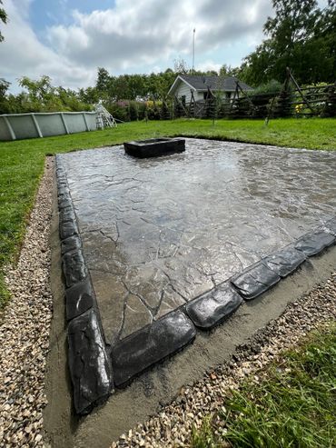 Flagstone patio with central fire pit