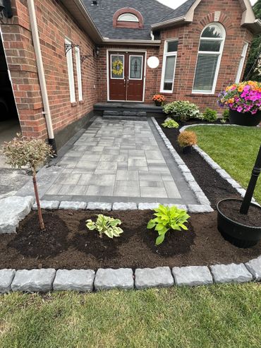 Interlock front walkway with plants
