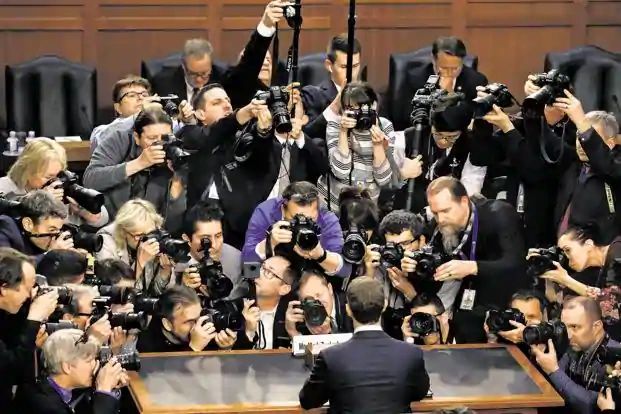 Facebook CEO Mark Zuckerberg is surrounded by members of the media as he arrives to testify in Washington, on 10 April. Photo: Reuters
