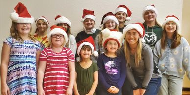 Colorado POA youth members all wearing Santa hats.