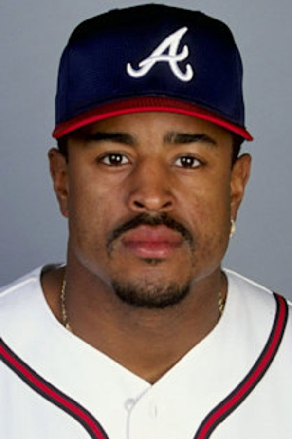 Portrait of a baseball player in Atlanta Braves uniform and cap.