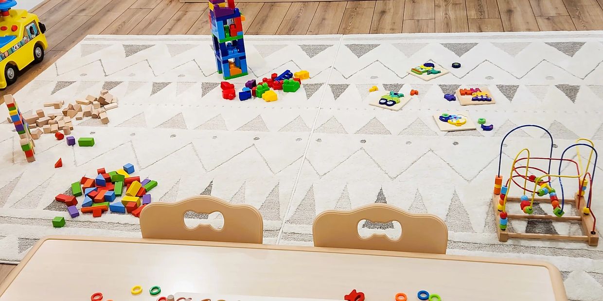 Joy Daycare Mississauga classroom setup with blocks, puzzles, and games for different age groups
