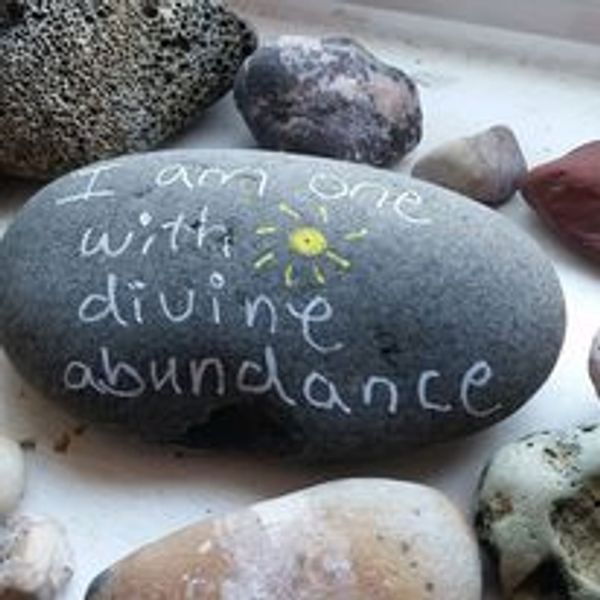 Abundance message on stone for manifesting