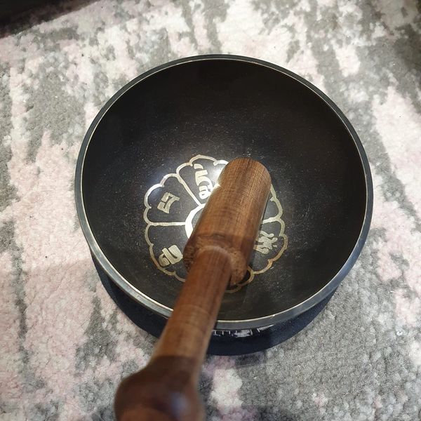 Sound healing with a himalayan singing bowl.