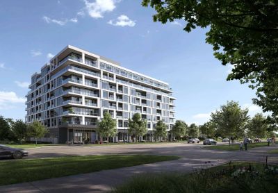 Modern multi-story residential building with balconies and greenery.